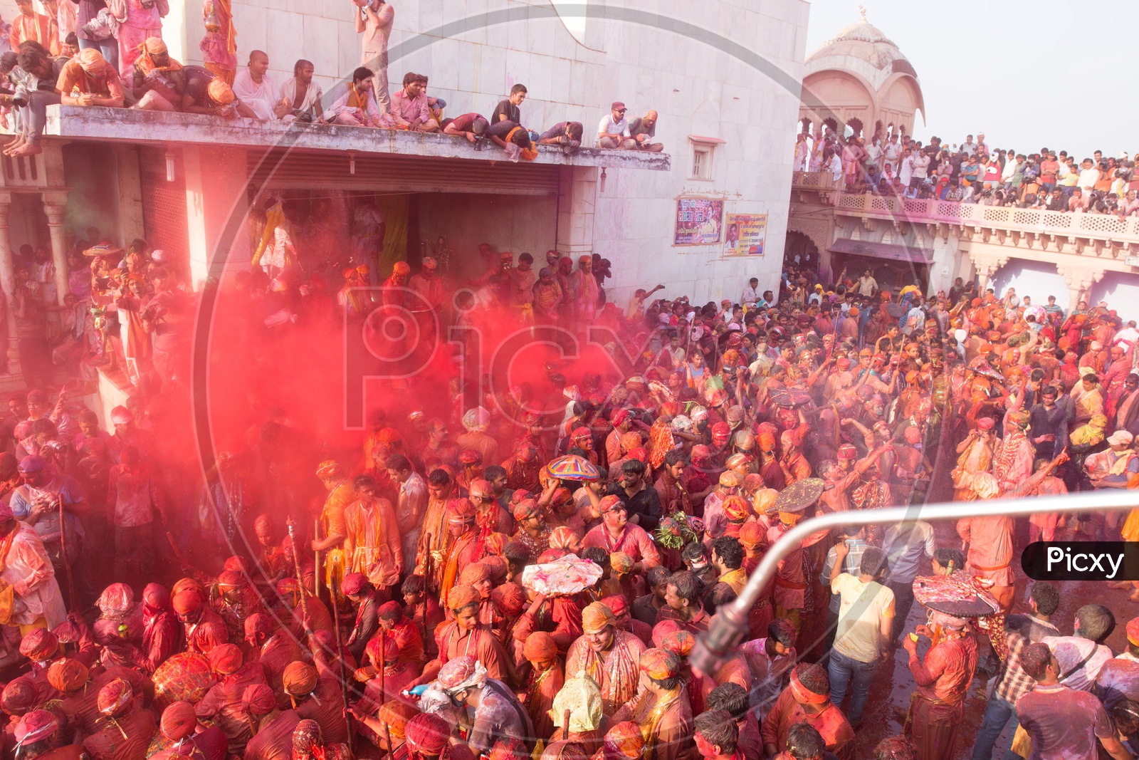 People celebrating Holi festival in Nandgaon