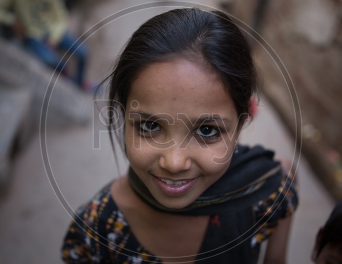 Portrait Of Young Indian Child With Smile Face on The Barsana Streets