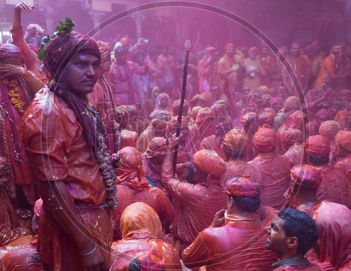 Local People In Barsana Celebrating Lathmar Holi as a Crowd Singing Songs And  Playing Drums Siting  With Color And Water Spalsh