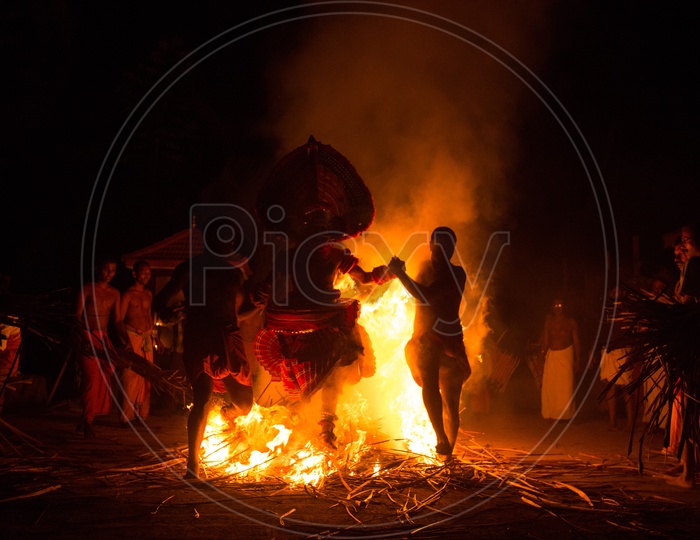 Artist performing Kalaripayattu during theyyam
