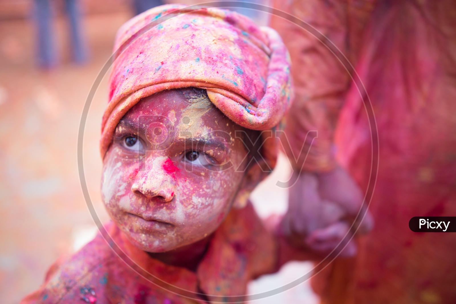 Child's face covered with Holi colors