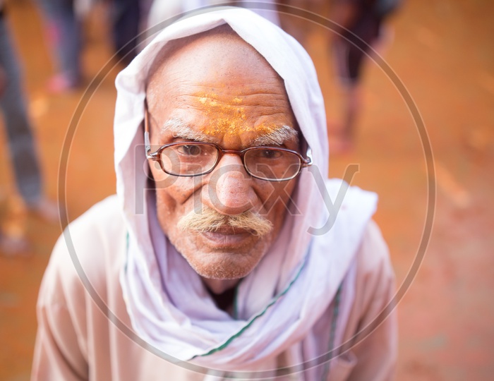 An Indian old man with spectacles