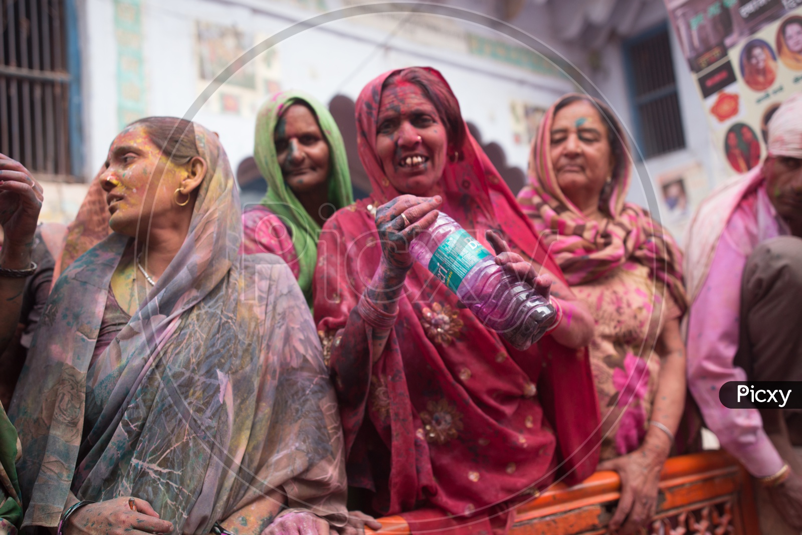 Woman Filled In Colors Celebrating Holi in Barsana Streets
