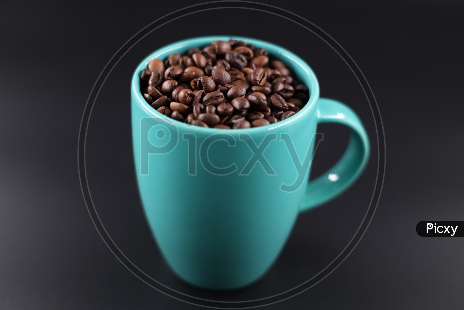 Coffee Beans In  Coffee Mug  Composition Shot On an Isolated Black Background