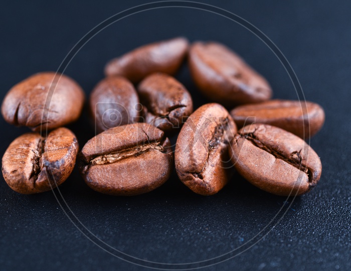 Close up shot of coffee beans on dark background