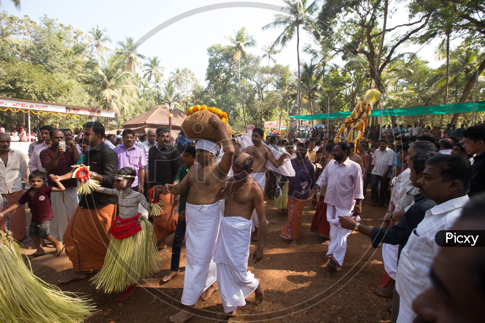 Devotees Performing Rituals At Bhagavathi Amman Temple In Kerala Worshiping her With Theyyam