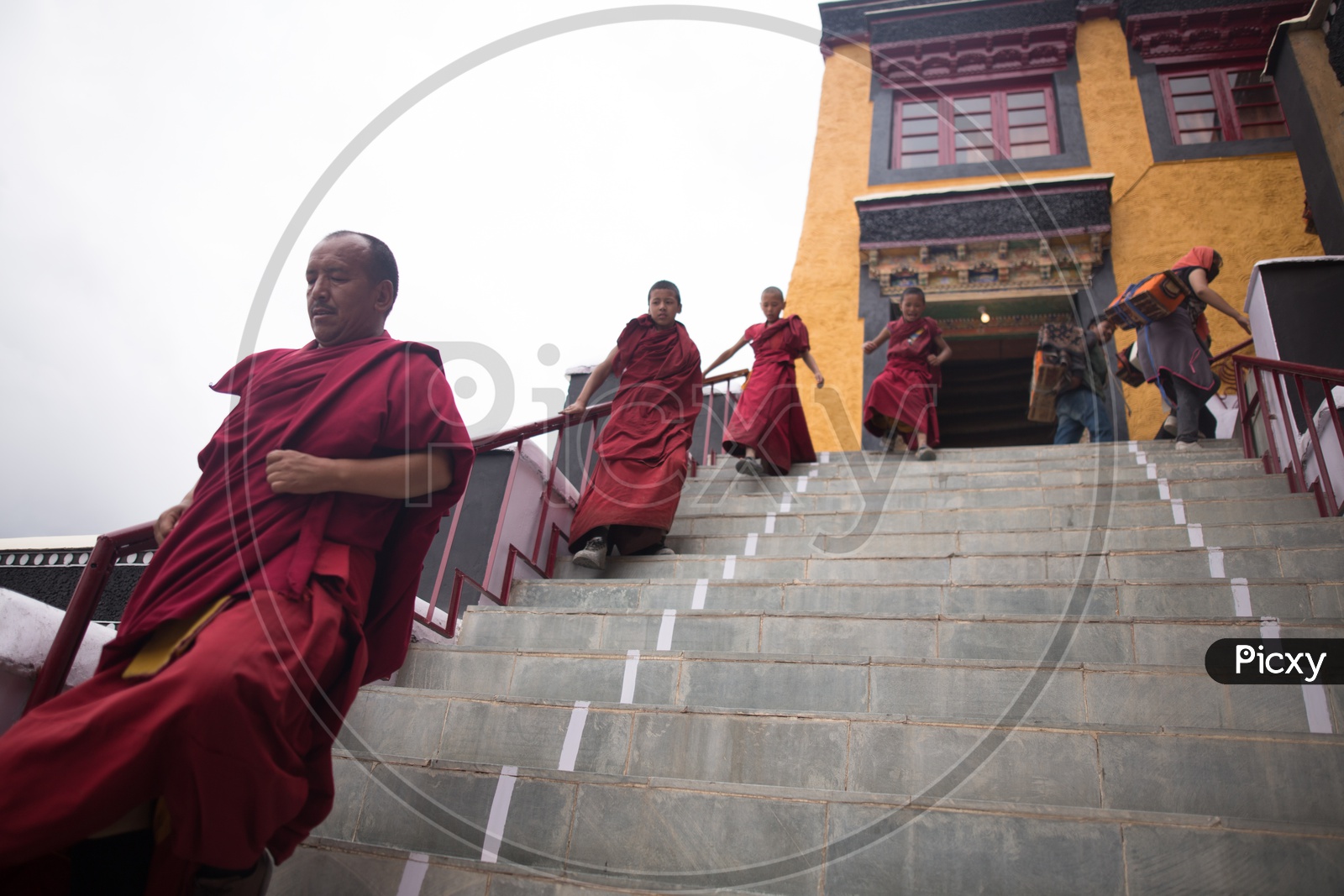 Buddhist Monks coming out of a monastery