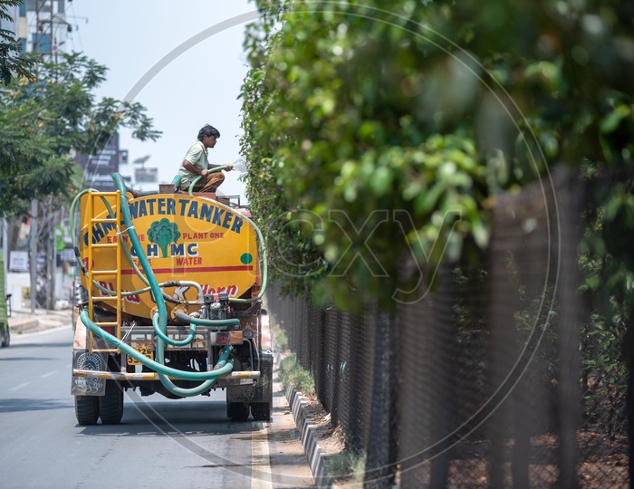 GHMC Water Tankers Watering The Plants On Road Dividers