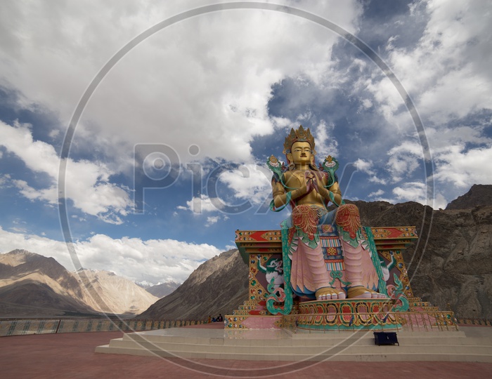 Diskit Monastery Buddha Statue with leh mountains in the background