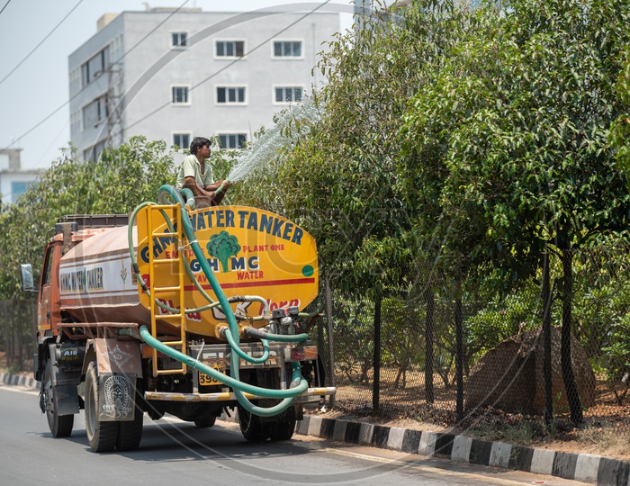 GHMC Water Tankers Watering The Plants On Road Dividers
