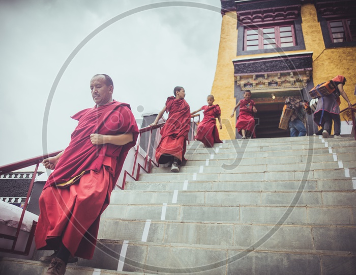 Buddhist Monks coming out from a monastery
