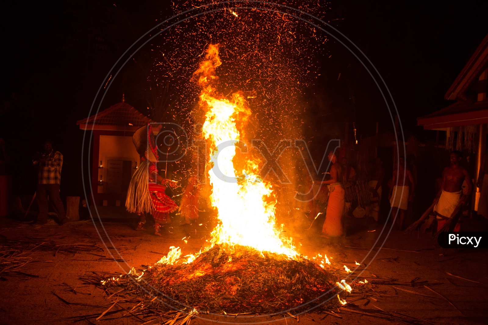 Devotees Making A Camp Fire As A Ritual  At Goddess Bagavathi  Amman Temples During Theyyam Performances