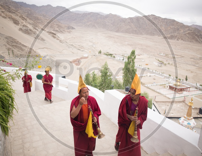 Buddhist Monks walking along the Monastery