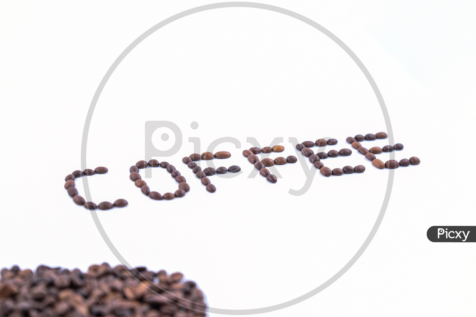 'Coffee' word made with coffee beans on white background