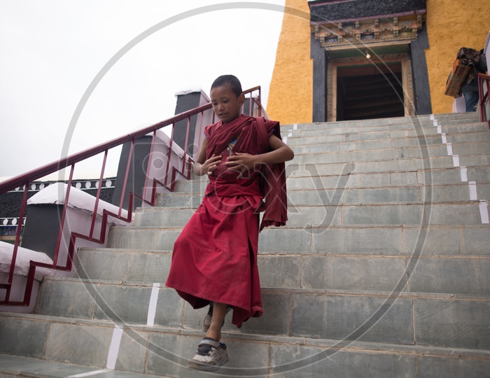 Young Monk coming out from the monastery