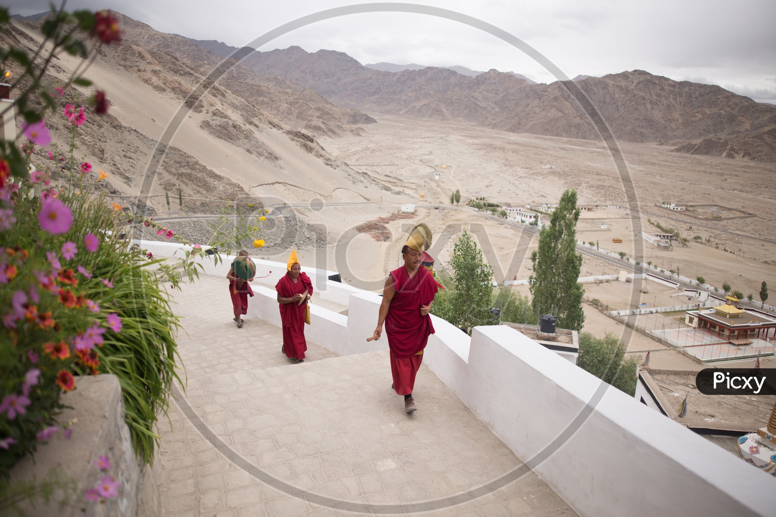 Buddhist Monks walking along the Monastery