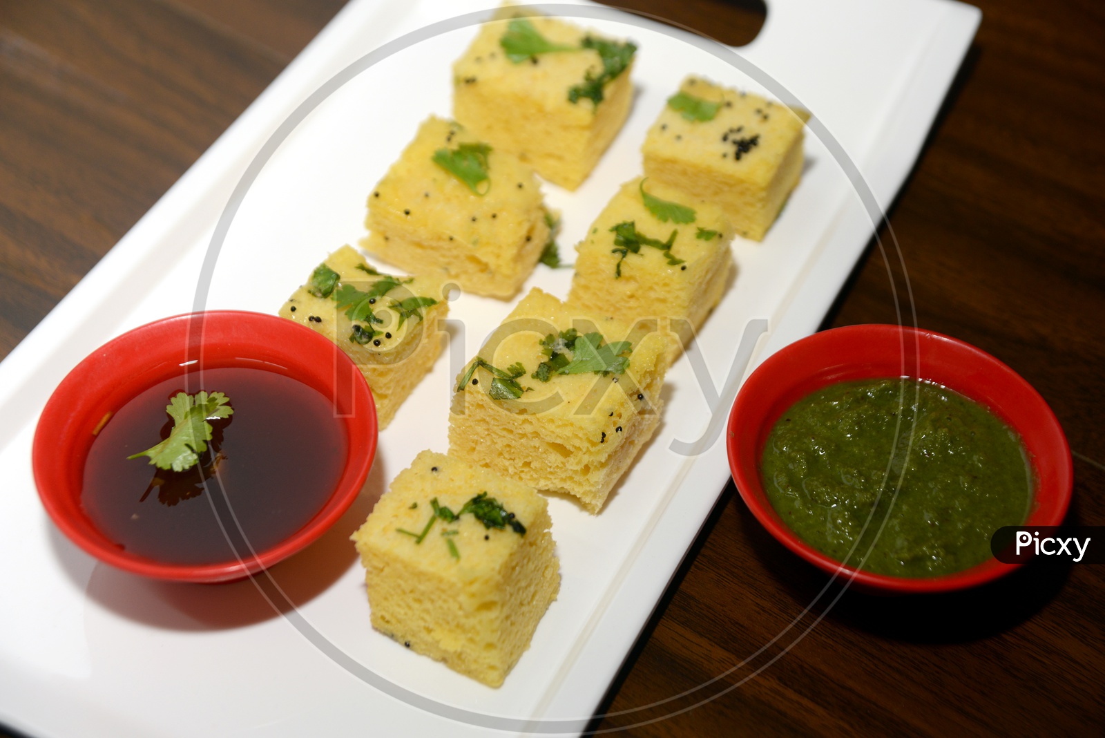 Gujarati food Khaman Dhokla with Chutney in bowl