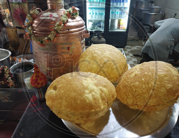 Indian Breakfast Puri Or Wheat Flour Ball in Street Food Vendor Stalls