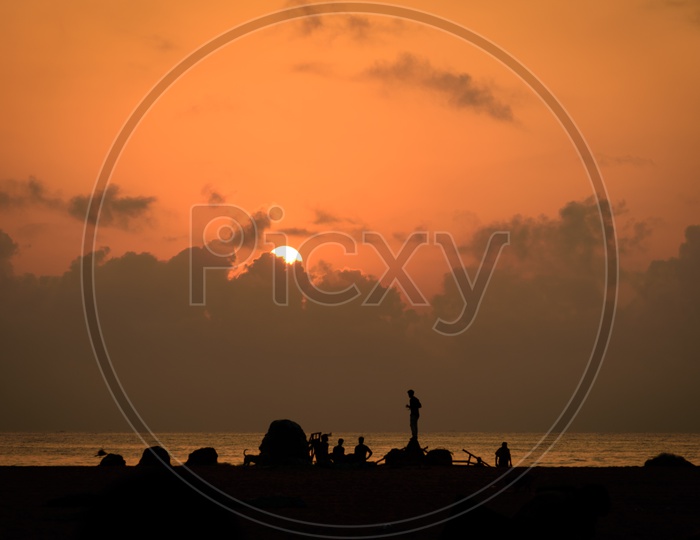Labours at Marina Beach during sunrise