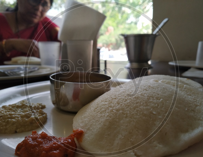 Idli with a pickle served in a plate