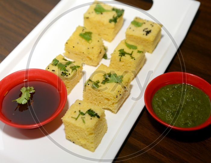 Gujarati food Khaman Dhokla with Chutney in bowl