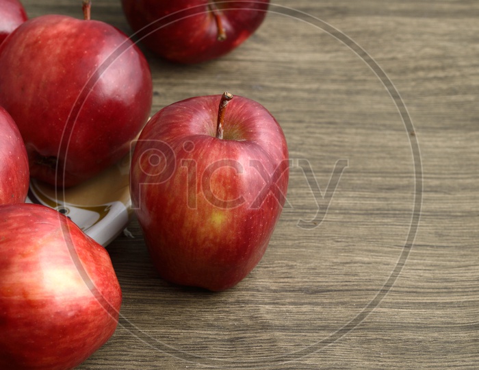 Fresh Red Apples On an Wooden Background