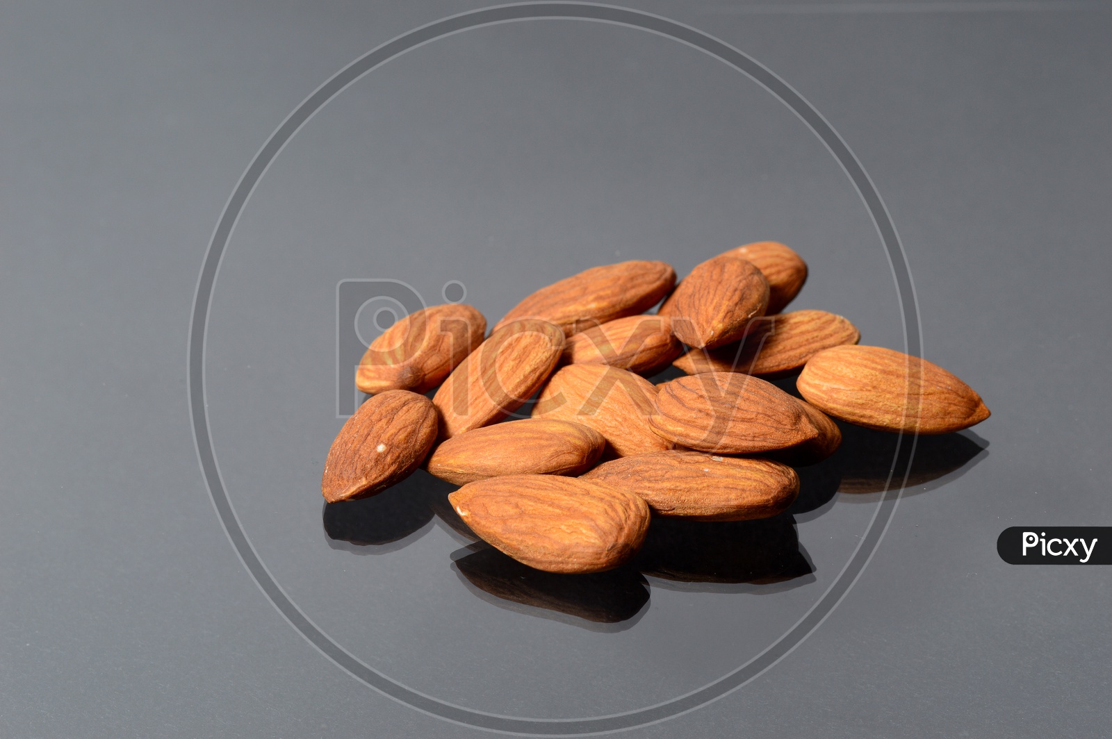 Almonds Or Badam  Nuts On An Isolated Background