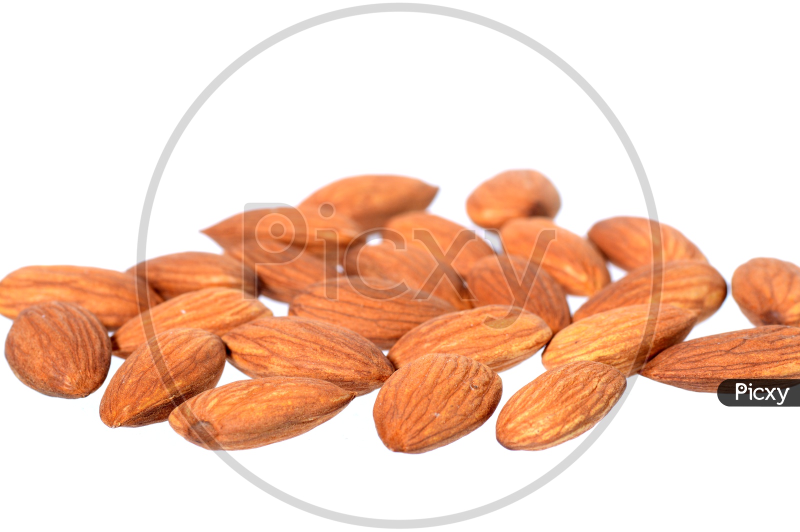 Almonds Or Badam Nuts Scattered on An Isolated White Background