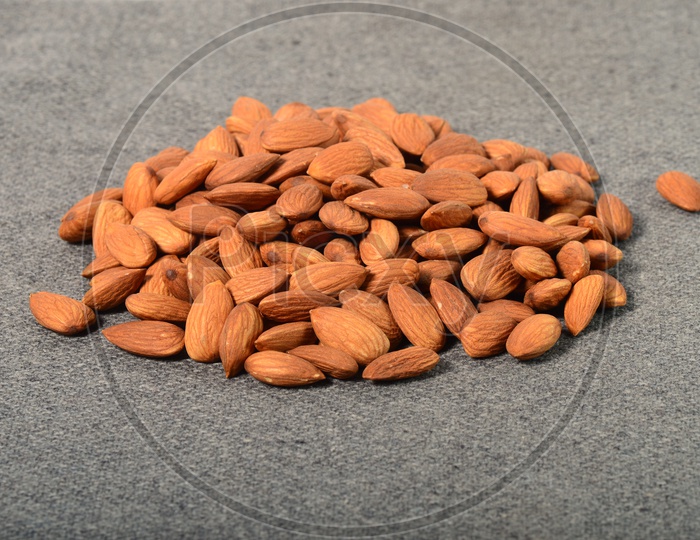 Almonds Or Badam  Nuts Pile  Closeup On an Isolated Background