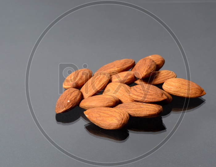 Almonds Or Badam  Nuts On An Isolated Background