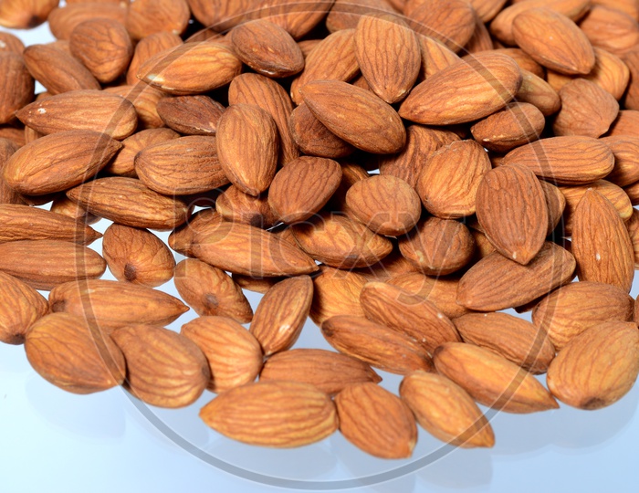 Almonds Or Badam  Nuts Pile  Closeup On an Isolated Background