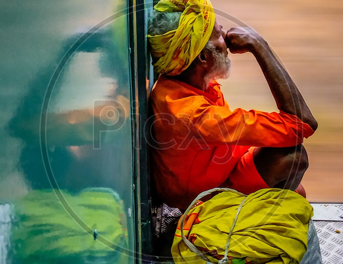 Indian Devotee travelling on general compartment