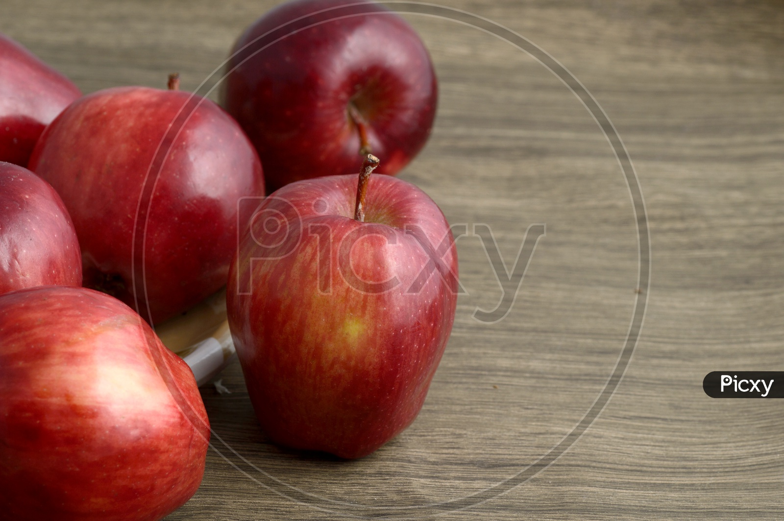 Fresh Red Apples On an Wooden Background
