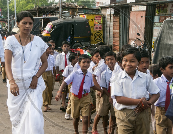 School Kids in their School Uniforms Holding Indian National Flags on Independence Day Celebrations At School