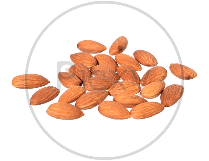 Almonds Or Badam Nuts Scattered on An Isolated White Background
