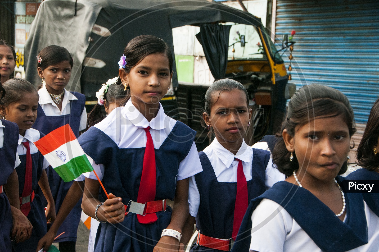 School Kids in their School Uniforms Holding Indian National Flags on Independence Day Celebrations At School