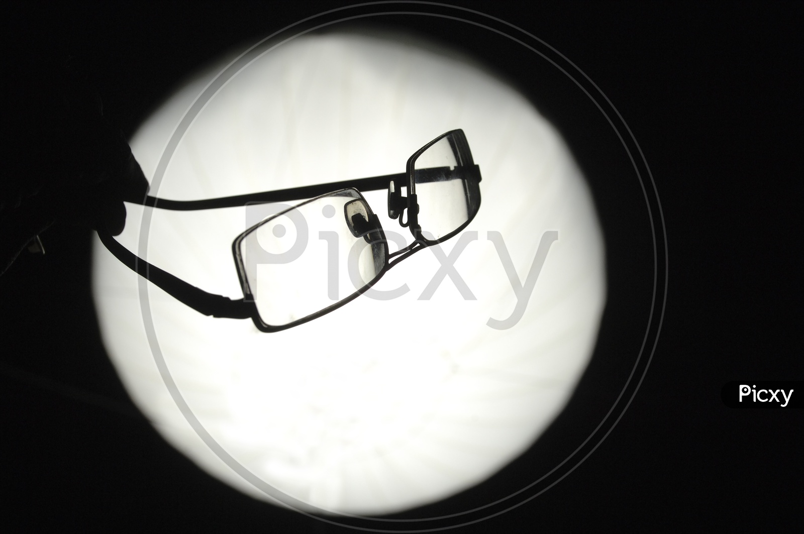 Silhouette of reading glasses