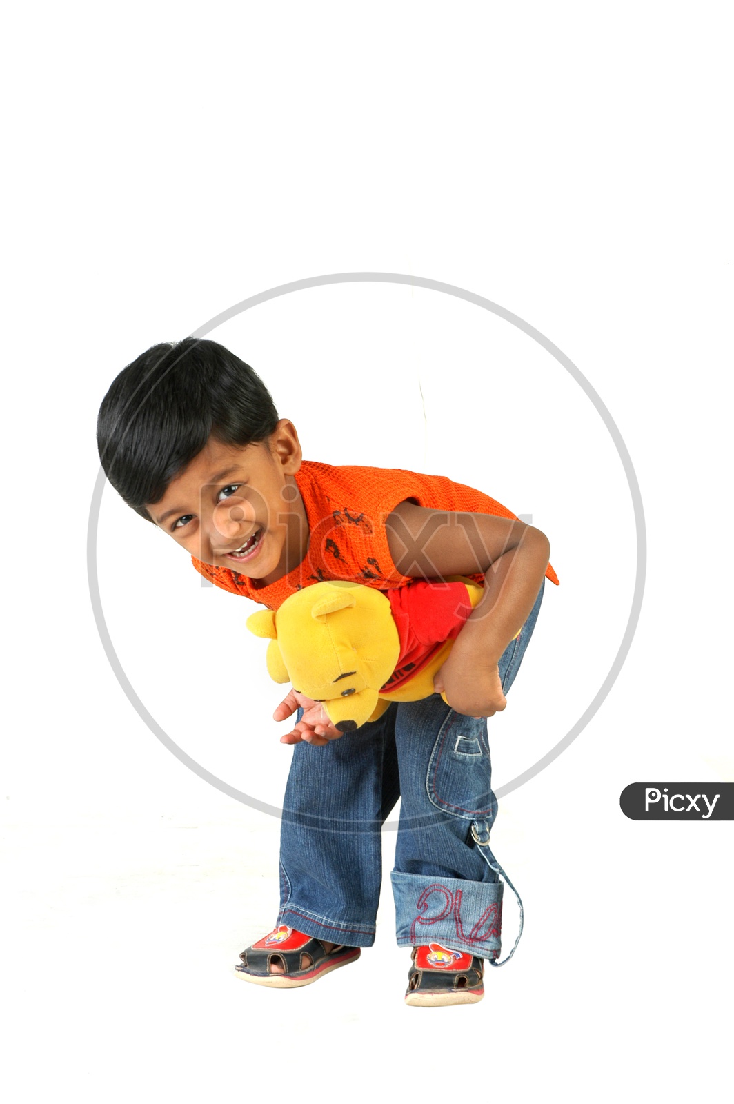 Indian boy holding a toy