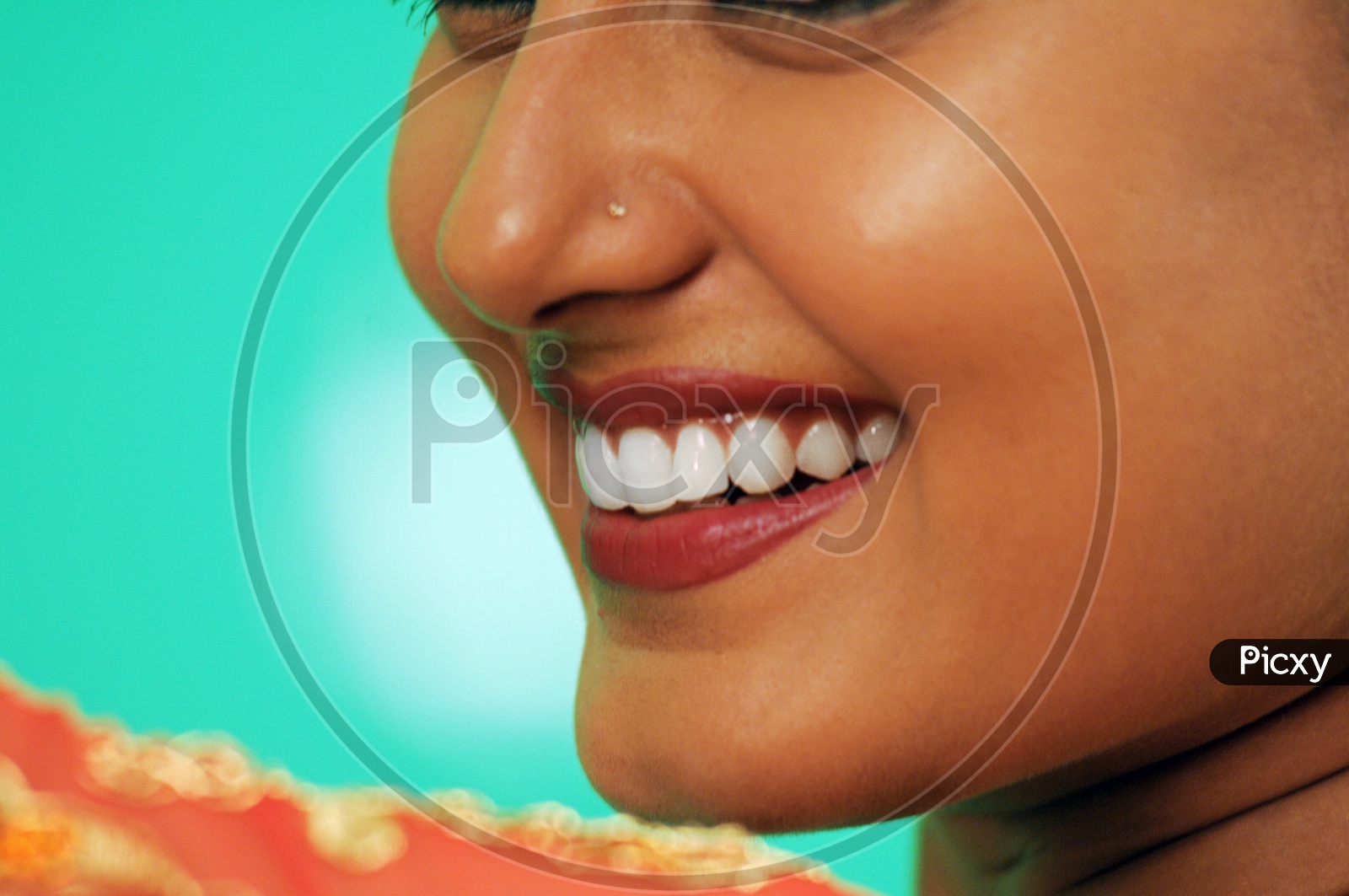 Indian Woman smiling wearing lipstick