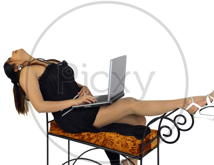 Indian woman wearing one piece with laptop