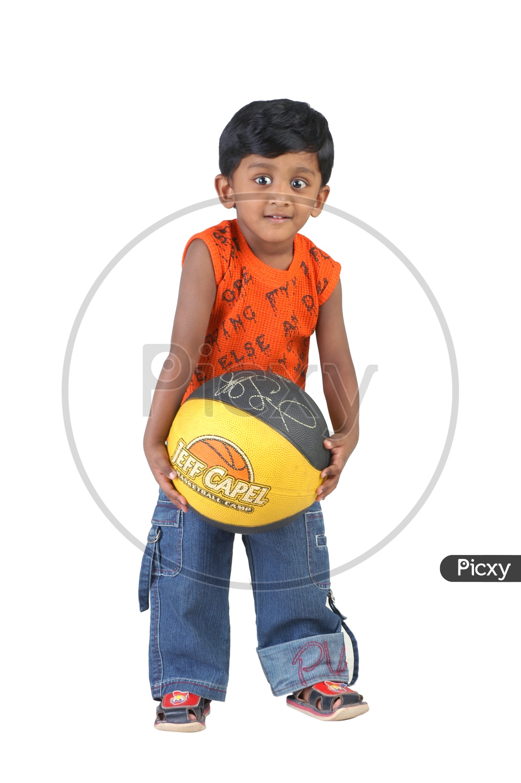 Indian boy holding a throw ball