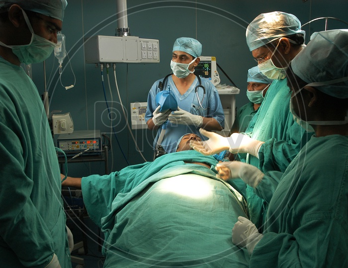 Surgeon team performing surgery in operation theatre