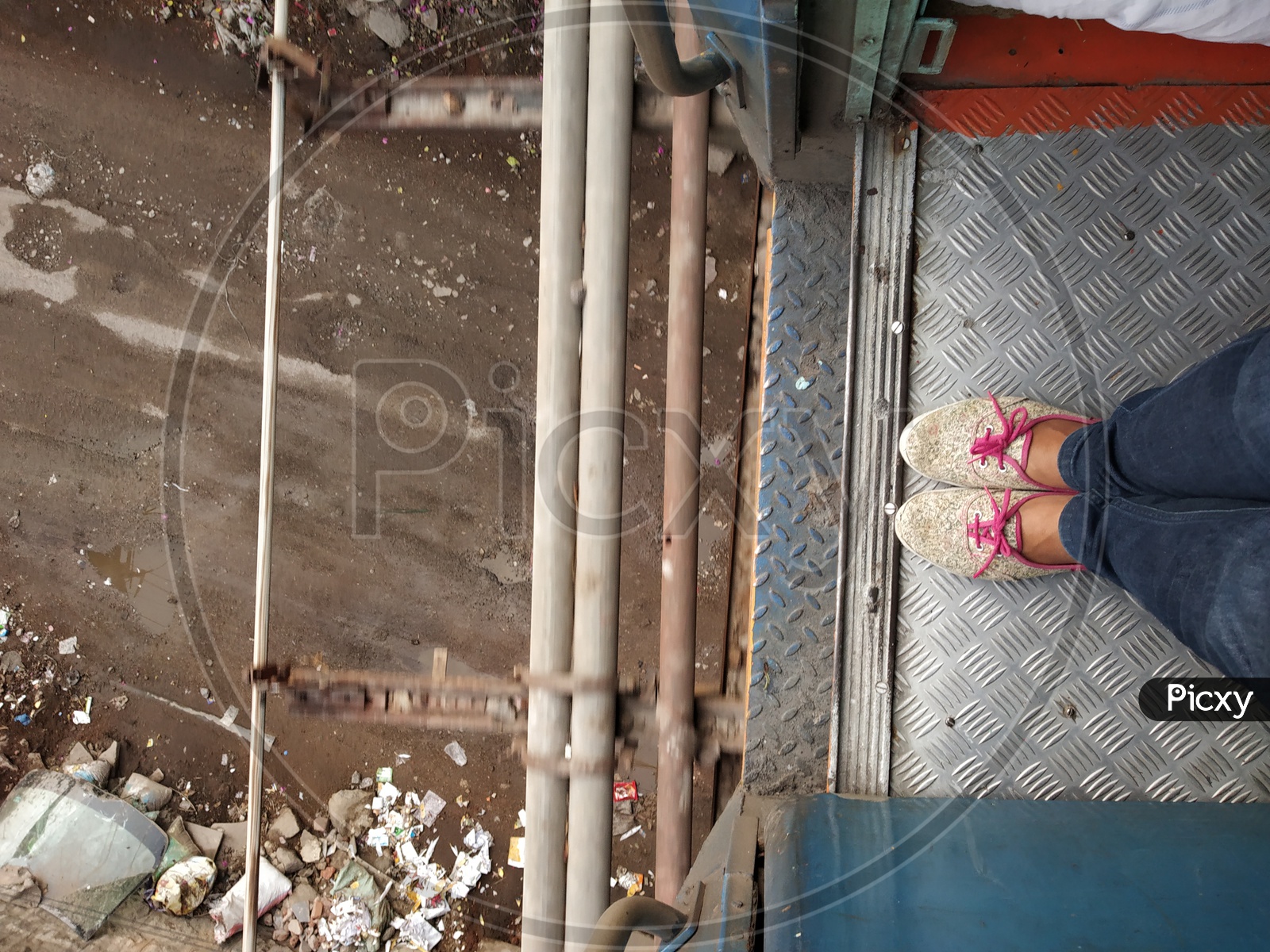 A Young Girl Foot Standing at The Train Door Step