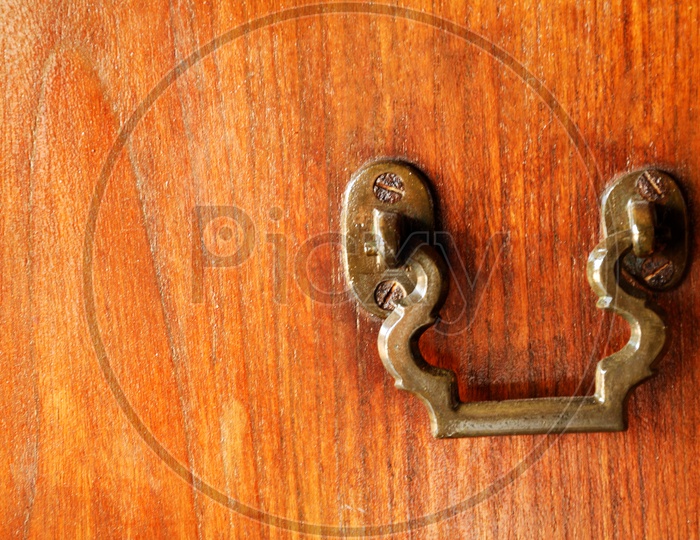 Iron handle of a wooden door