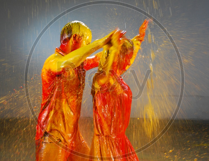 A Couple dancing in the dripping colours