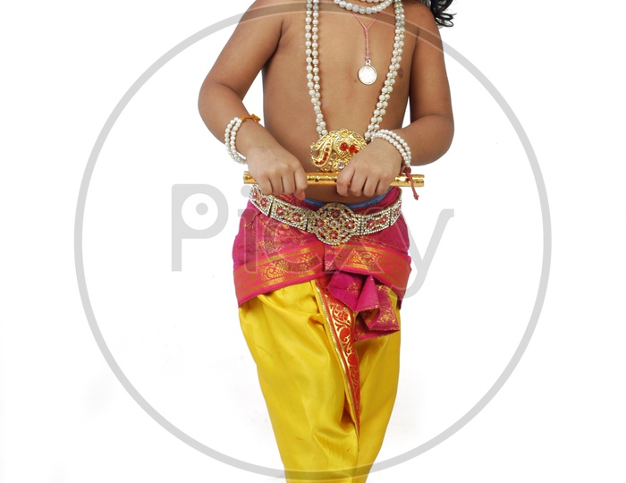 Indian boy dressed up as Hindu God Krishna