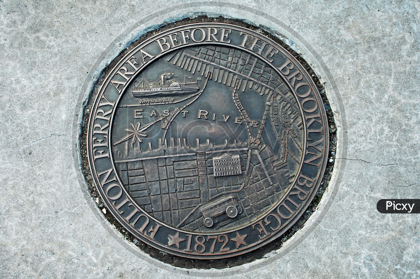 Representation of Fulton ferry area before the Brooklyn Bridge, 1872 on a metal