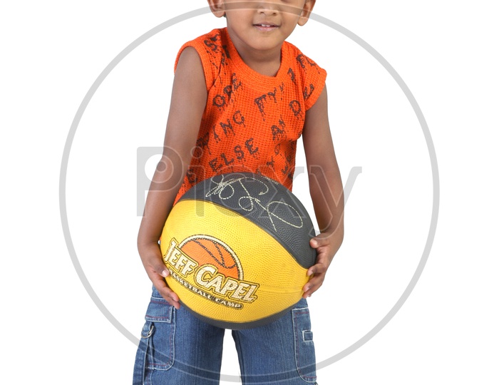 Indian boy holding a throw ball