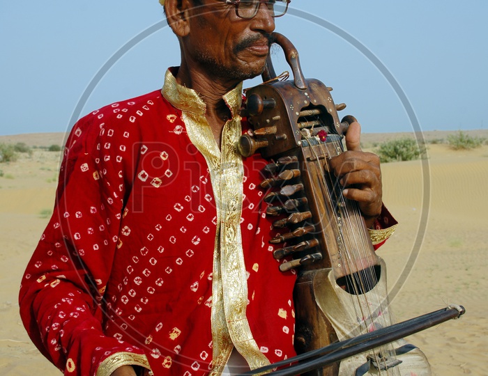 Rajasthani Man playing an ancient violin