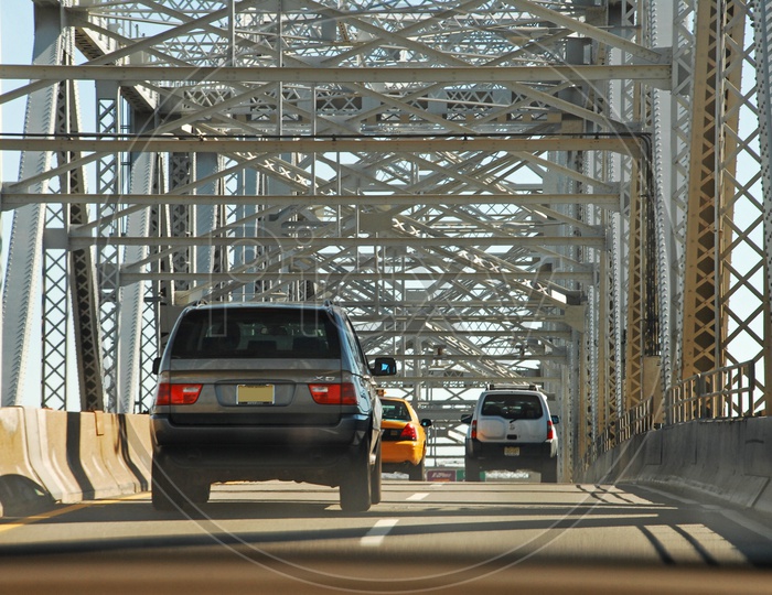 Moving cars on a bridge